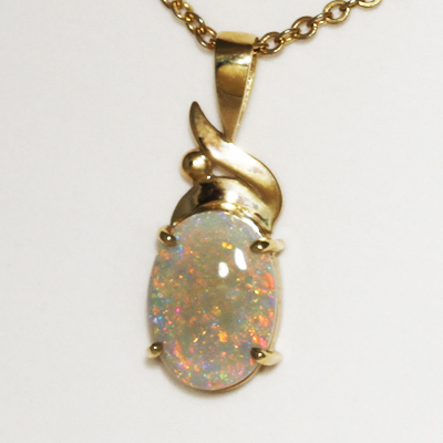 9k Yellow Gold Pendant with a SOLID SEMI BLACK OPAL Bright Pinfire pattern. Orange, yellow and green sparkle through a clear body